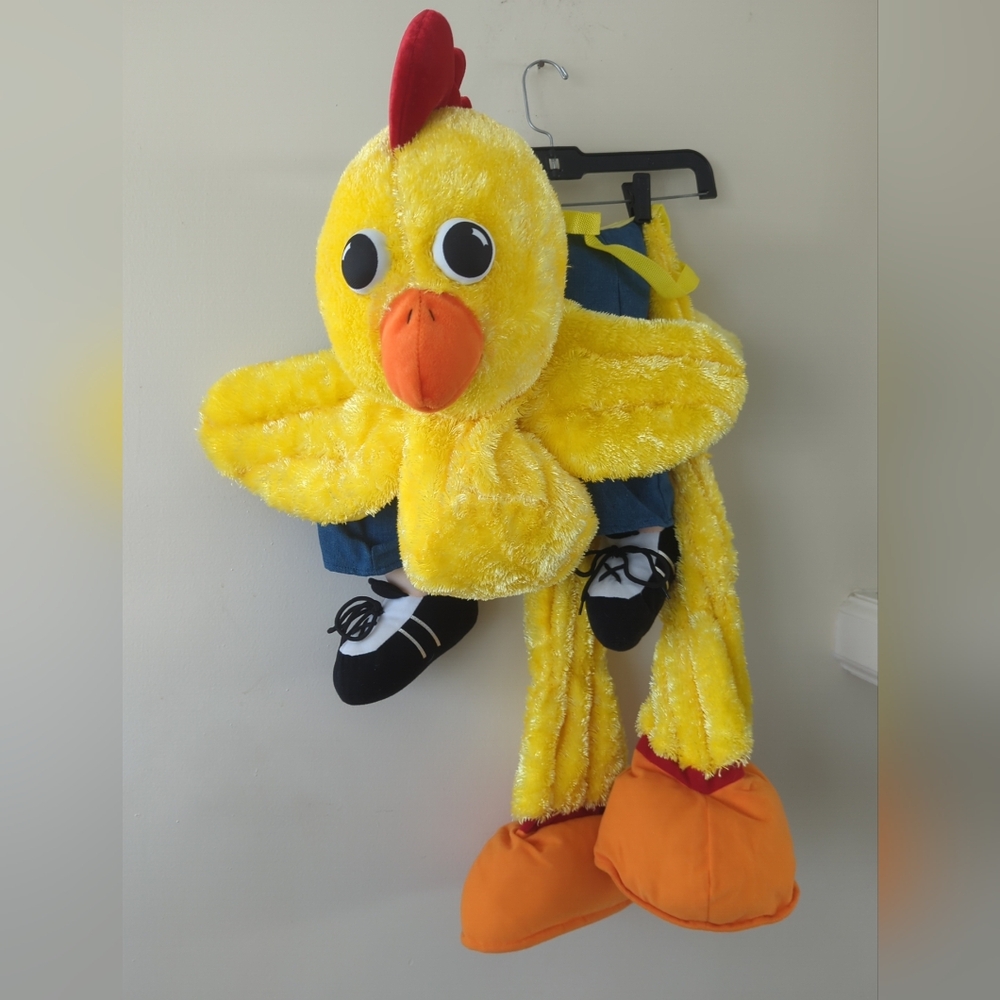 Person riding a chicken costume Halloween dress up ages 3 to 6